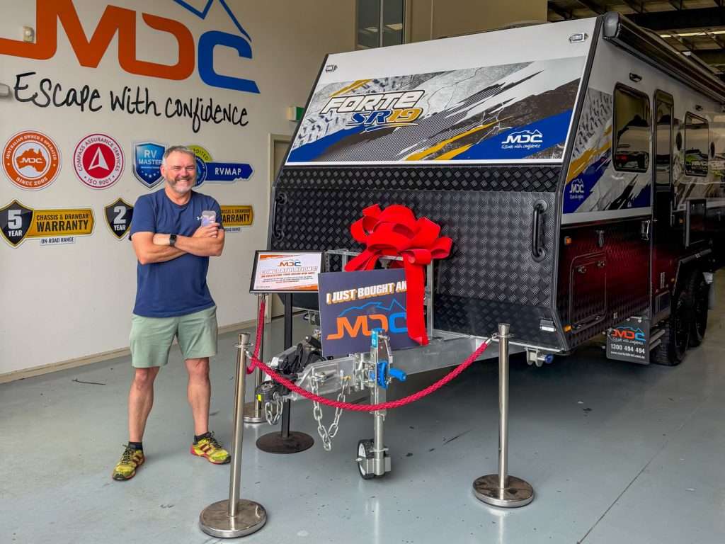 Bruce Newton taking deivery of his MDC Forte SR19 tandem-axle caravan ahead of his lap around Australia
