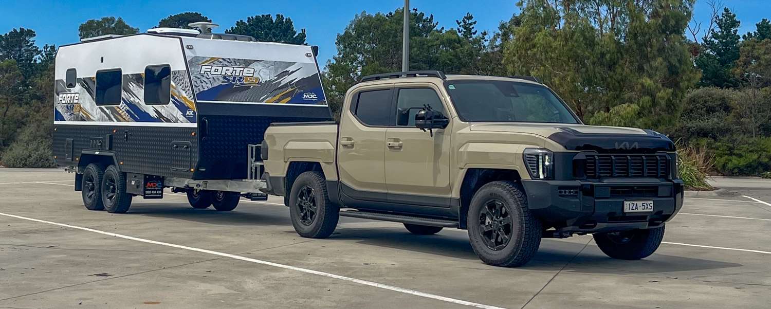 Kia Tasman and an MDC Forte SR19 tandem-axle caravan getting ready for a lap of Australia